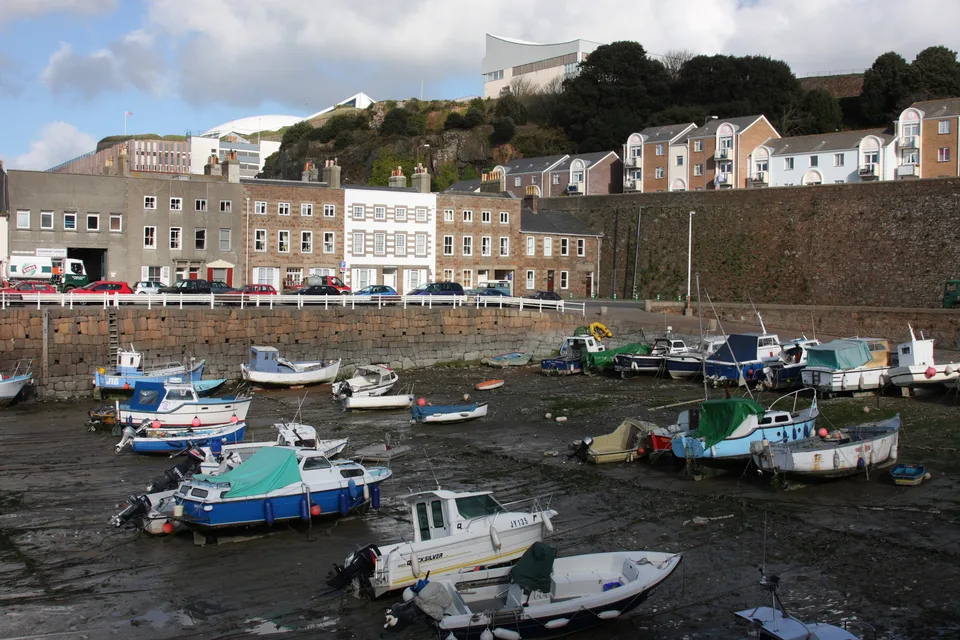 Boats in English Harbour in St Helier, Jersey, at low tide